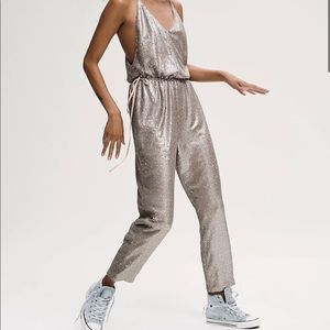 Free People jumpsuit. Size medium. Brand new with tags